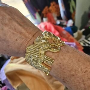 This is a Lilly Pulitzer gold-tone clamp bangle hinged elephant cuff bracelet